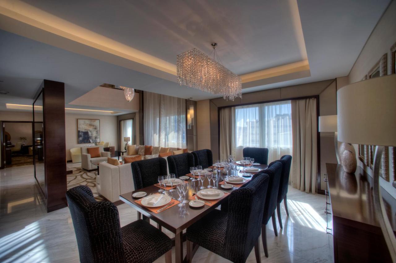 Crowne Plaza Dubai Deira By Ihg Hotel Exterior photo A dining room in a suite at the Ritz-Carlton, DIFC